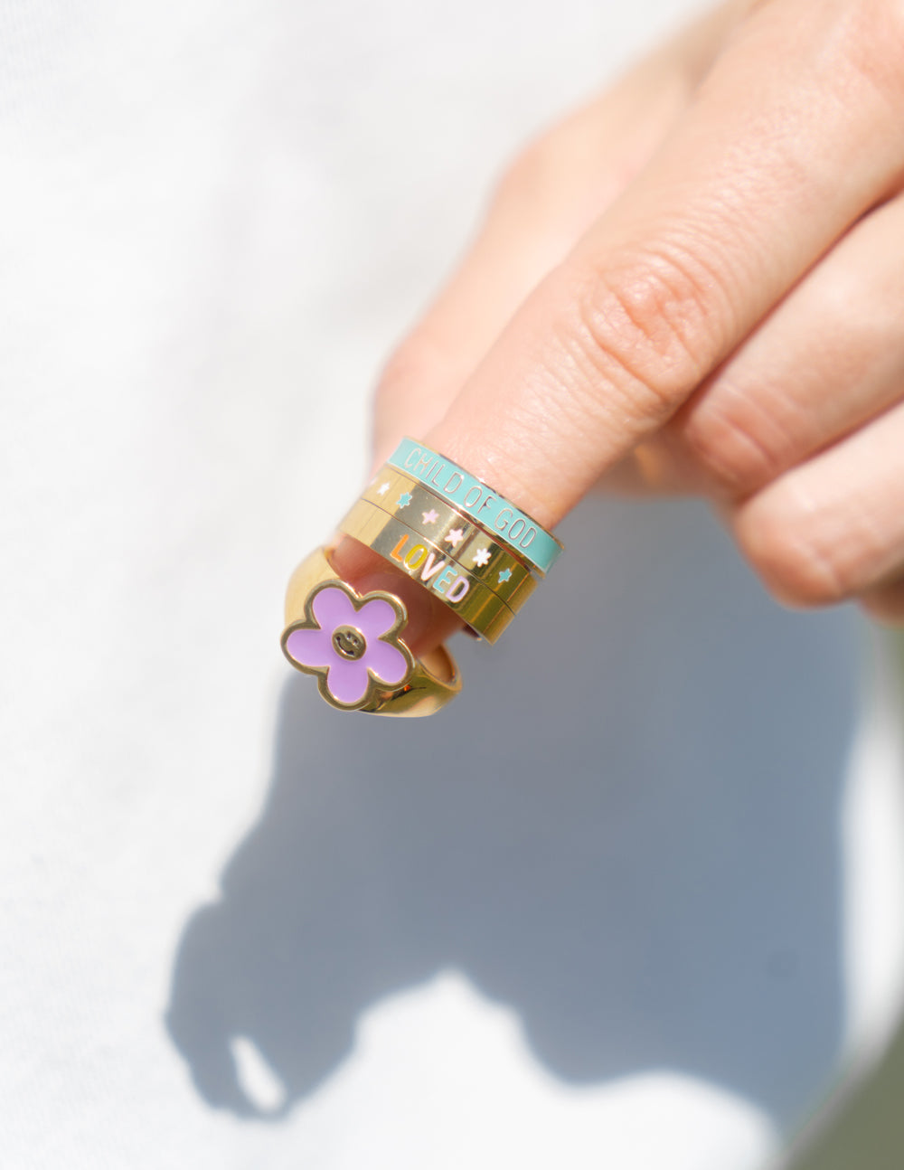 Elevated Faith Christian Jewelry Ring Stack Featuring Colorful Flower and Inspirational Text