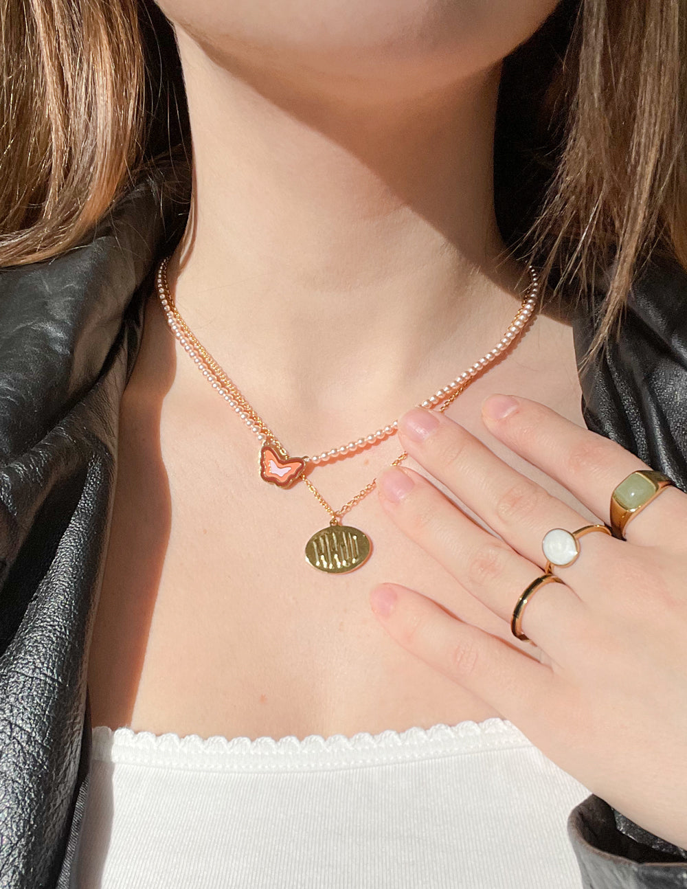 Elevated Faith Christian Jewelry Necklace featuring a heart pendant and a textured charm