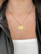 Gold Elevated Faith Necklace with engraved Christian Jewelry pendant worn on a model