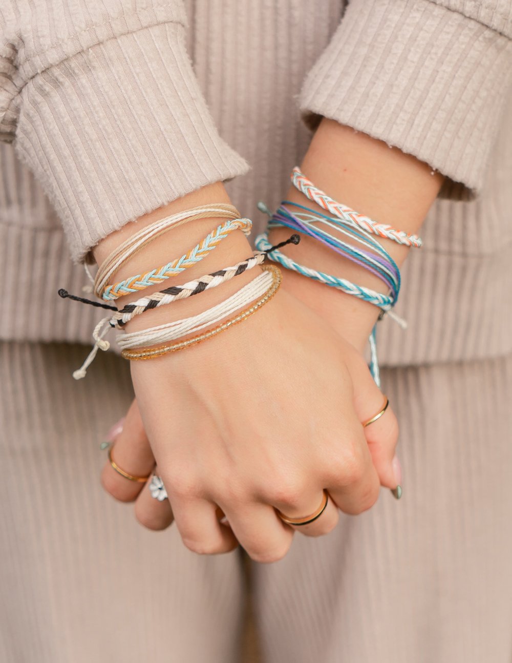 Multiple Elevated Faith String Bracelets in various colors showcasing a stylish Christian Bracelet design.