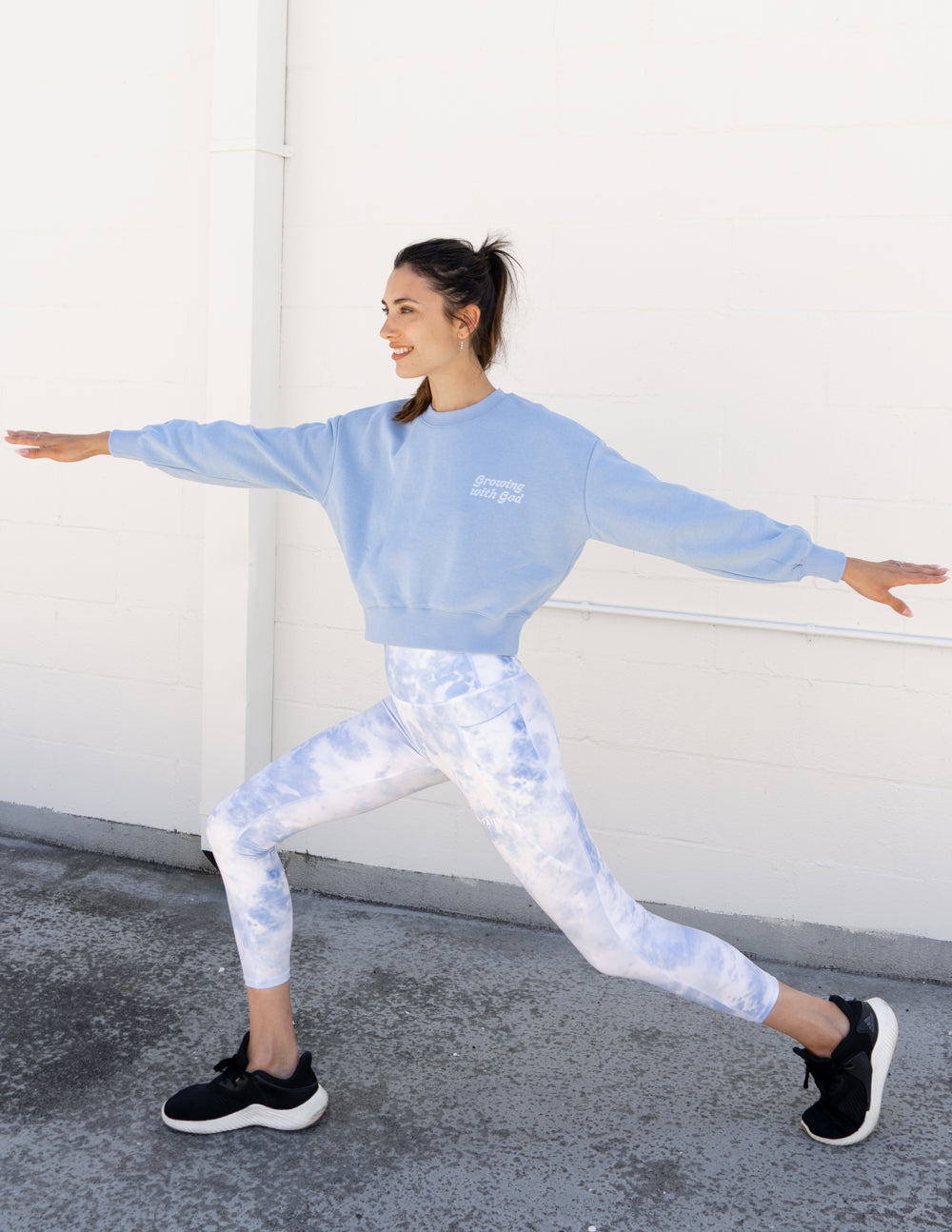 Elevated Faith Christian Crewneck Sweatshirt in light blue, styled with tie-dye leggings for a trendy look