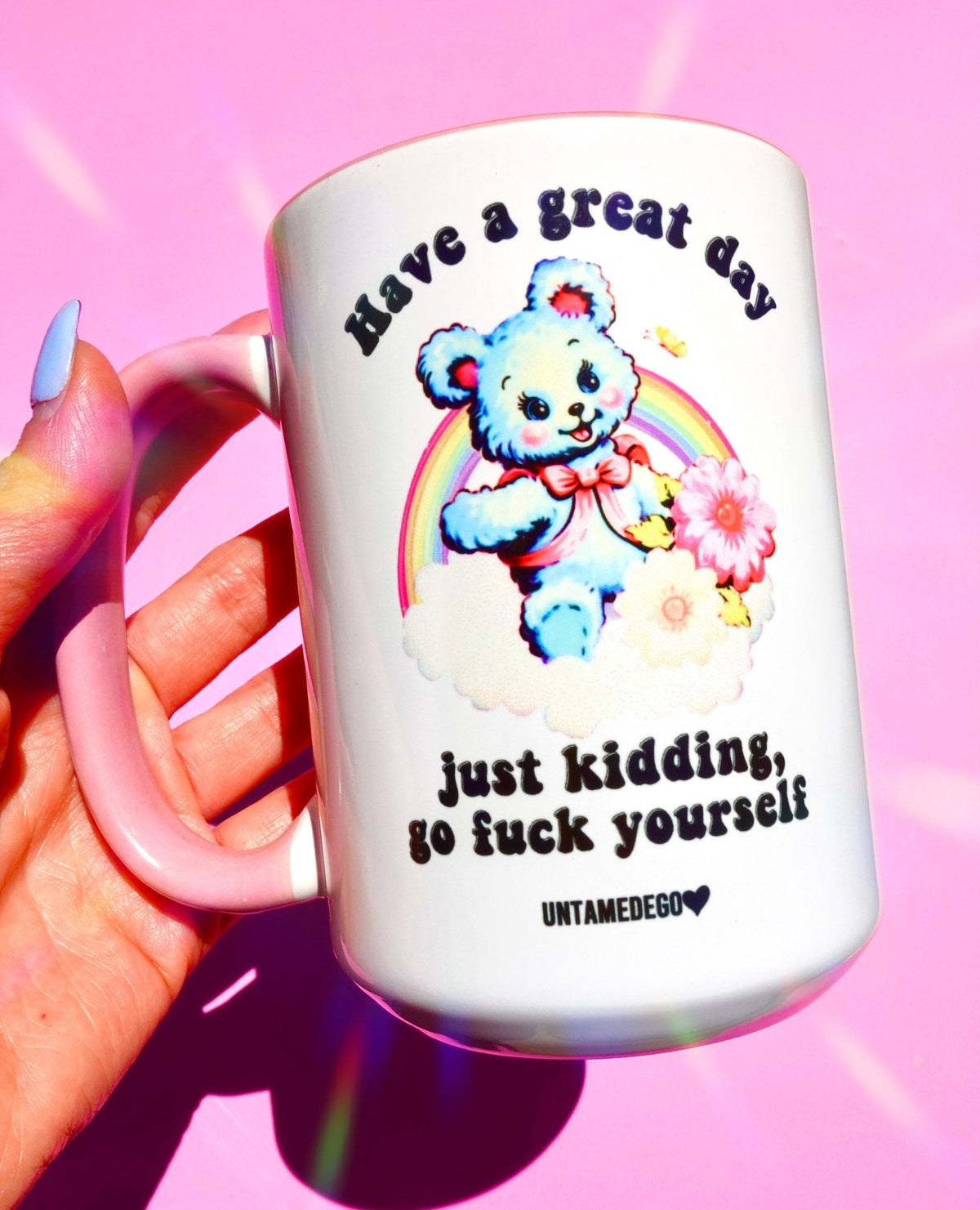 Funny "Have A Great Day Just Kidding" — White mug with bear illustration and humorous text, held in hand
