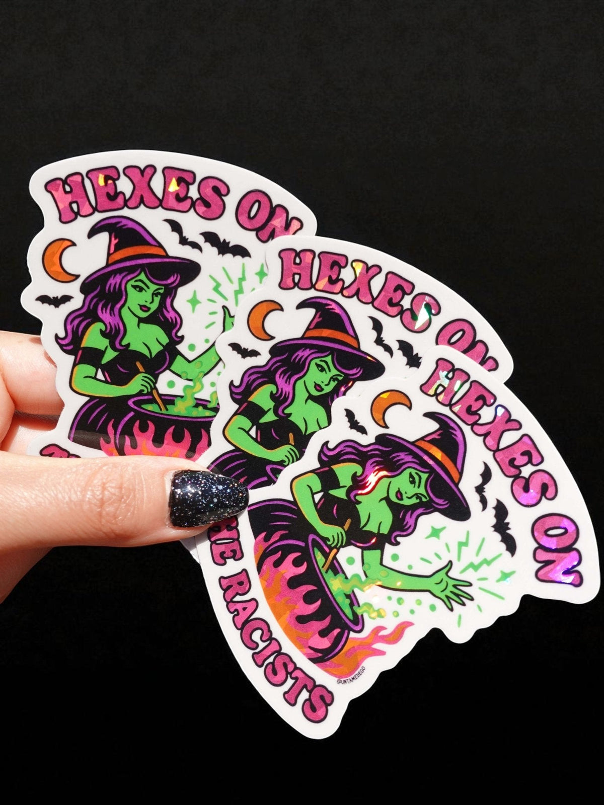 Funny Halloween vinyl sticker collage of three green witches, cauldrons, HEXES ON THE RACISTS