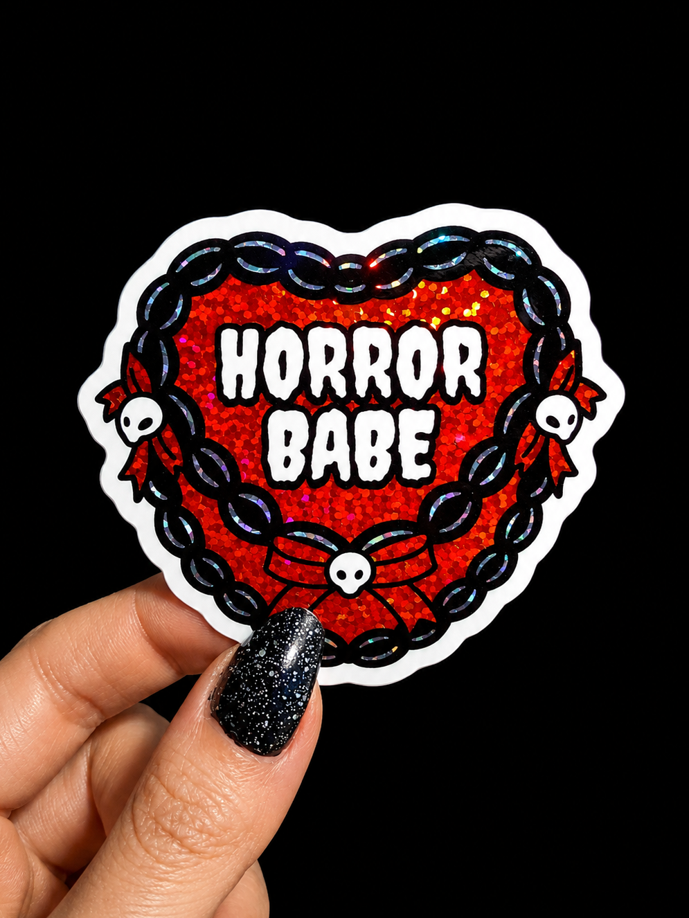 Funny Heart-shaped sticker with red glitter 'Horror Babe' text, blue chain border, skull icons
