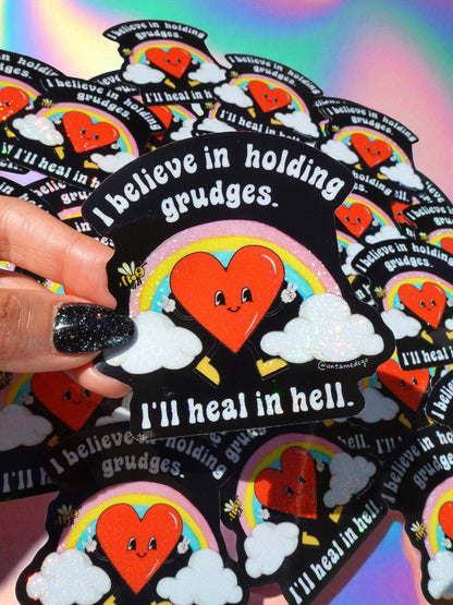 Funny Sticker pack of heart-devil designs with rainbow, clouds, and repeated 'I’ll heal in hell' text.
