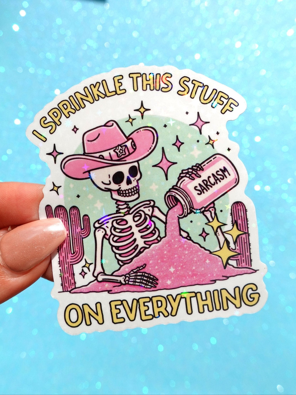 Funny Sarcasm sticker: cartoon skeleton sprinkling pink dust, 'I SPRINKLE THIS STUFF ON EVERYTHING'