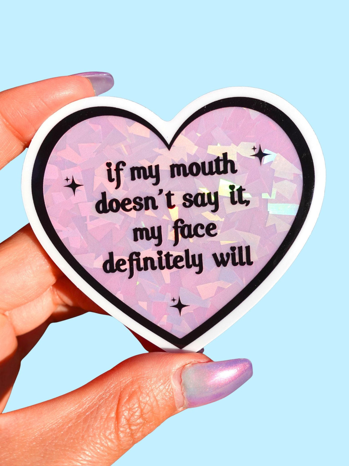 Funny Heart-shaped sticker, pink glitter pattern, text: if my mouth doesn't say it