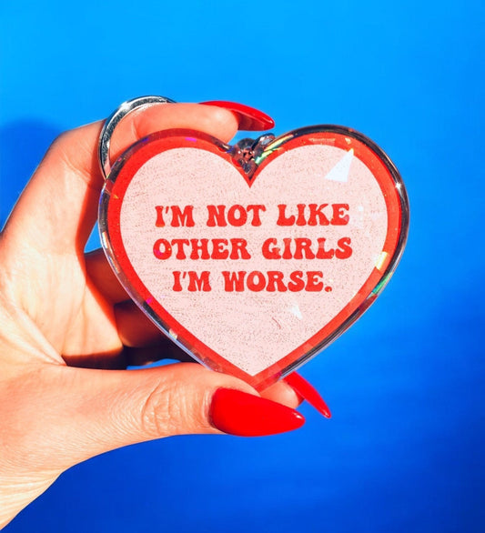 Funny Heart glitter holographic keychain with red 'I'm not like other girls' message