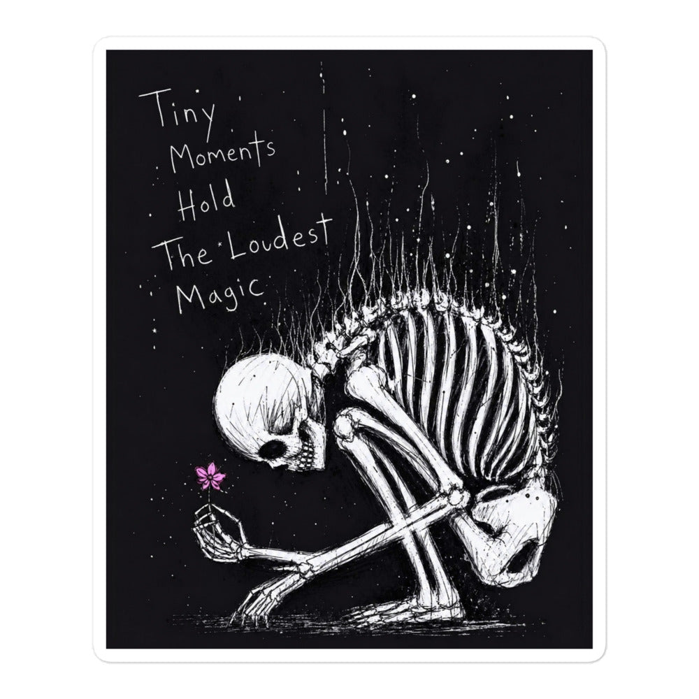 5.5 x 5.5 inch 'Tiny Moments' goth sticker featuring a kneeling skeleton holding a tiny pink flower on a black background, with the words "Tiny moments hold the loudest magic"