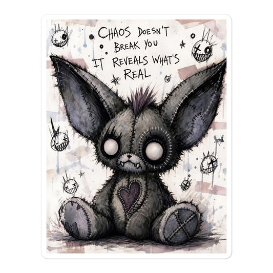 5.5 x 5.5 inch 'Chaos' goth sticker featuring a stitched gray big-eared creature with button eyes, with the words "Chaos doesn't break you, it reveals what's real"