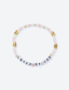 Elevated Faith Christian Jewelry Bracelet with pastel beads and letters spelling 'LOVED BY GOD'