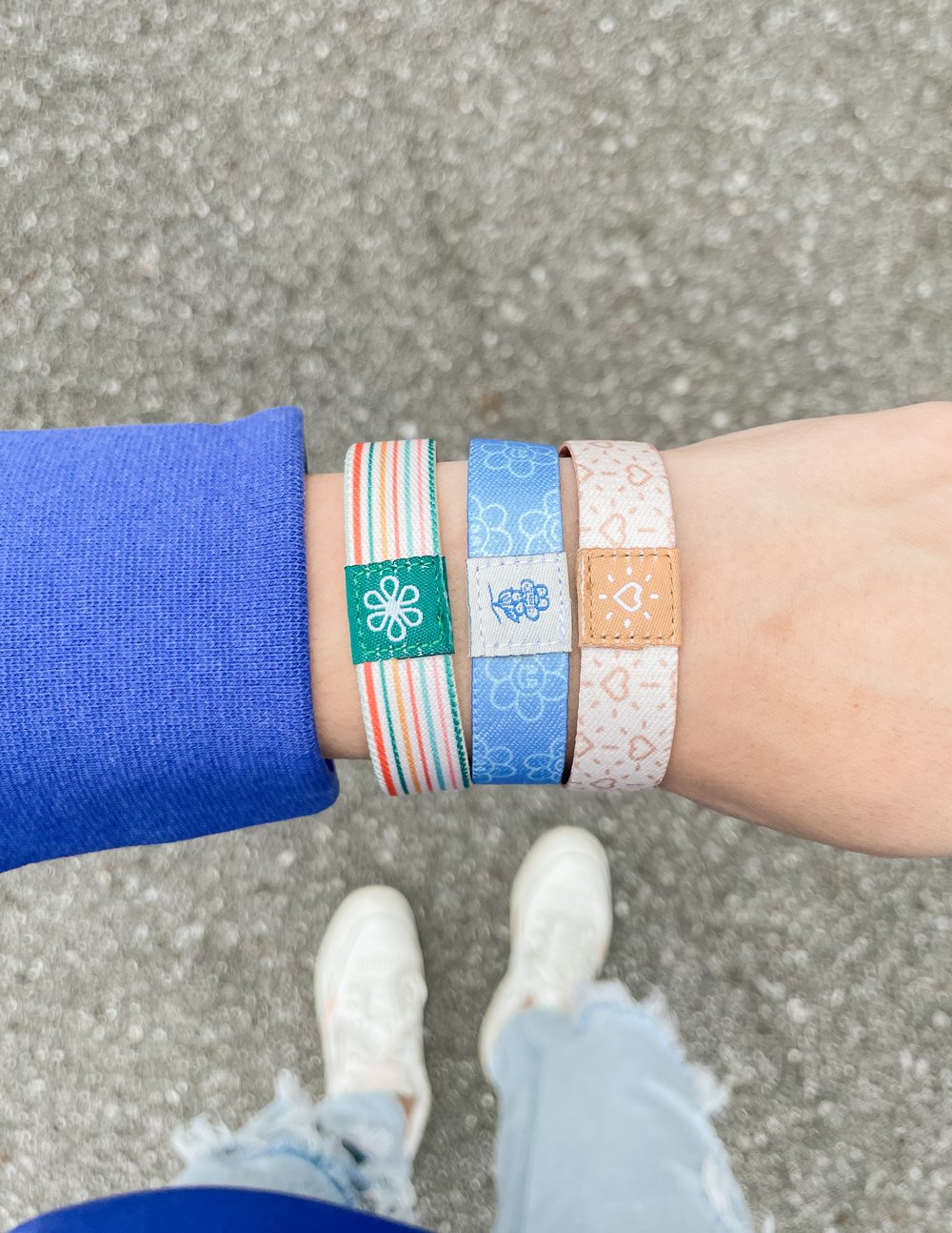 Set of Elevated Faith Christian Jewelry Bracelets in various colors and patterns worn on a wrist