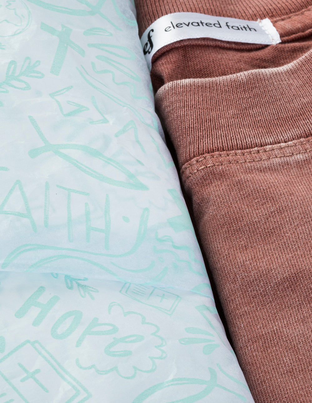 Elevated Faith packaging for Christian Apparel featuring inspirational designs and soft fabric