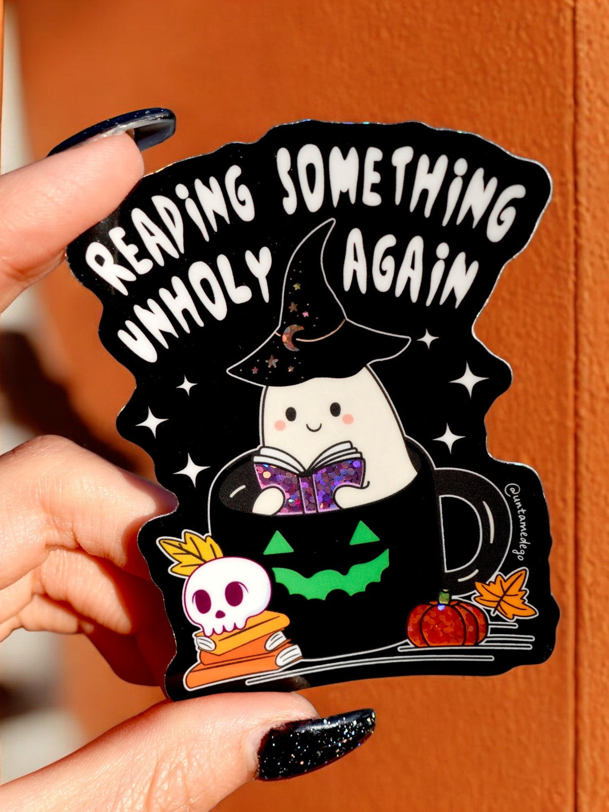 Funny Black witch reading sticker with skull, pumpkin, text, and stars