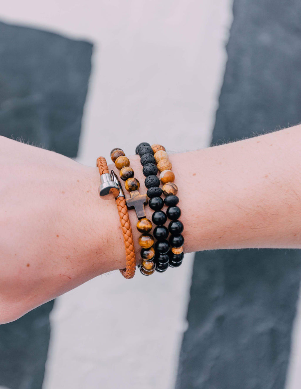 Elevated Faith Christian Jewelry Bracelet set with stone beads in brown, black, and gold on a wrist