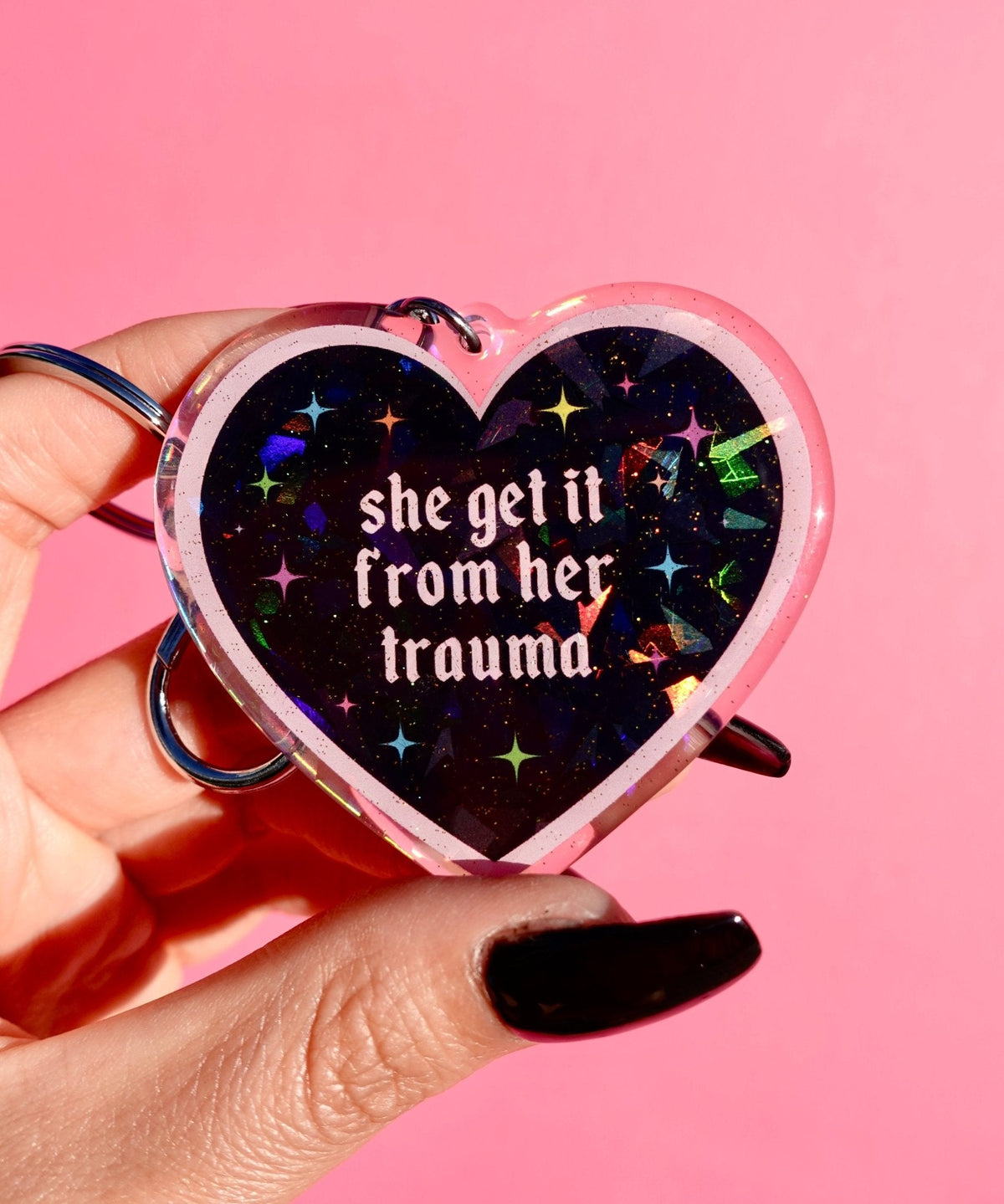 Funny Holographic heart keychain: 'she get it from her trauma'
