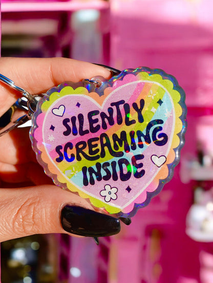 Funny Holographic heart keychain with rainbow 'Silently Screaming Inside' text