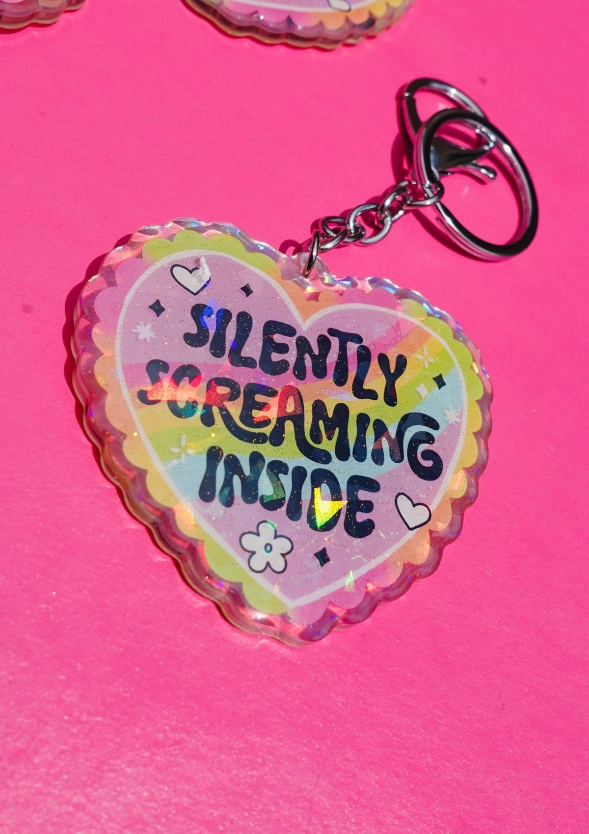 Funny Holographic heart keychain with metal clasp, reading 'Silently Screaming Inside'