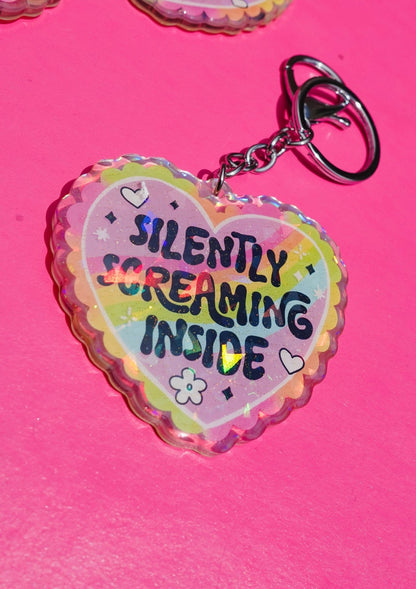 Funny Holographic heart keychain with metal clasp, reading 'Silently Screaming Inside'