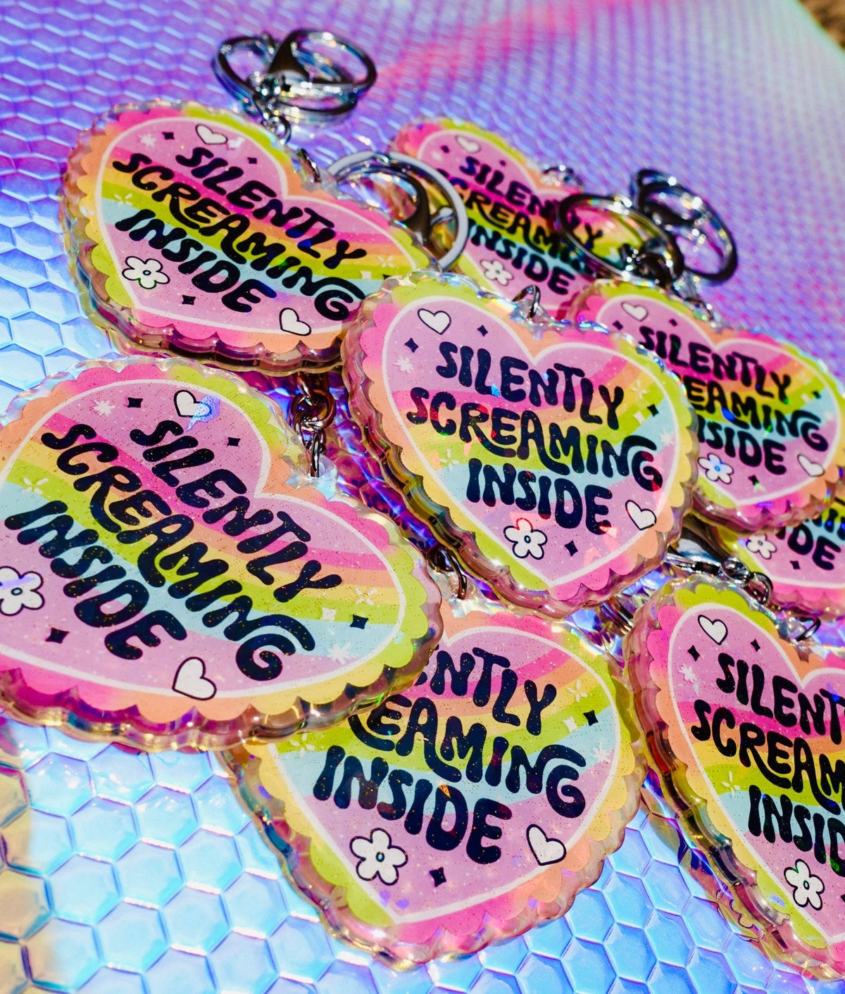 Funny Holographic heart keychains with 'Silently Screaming Inside' text and metal rings