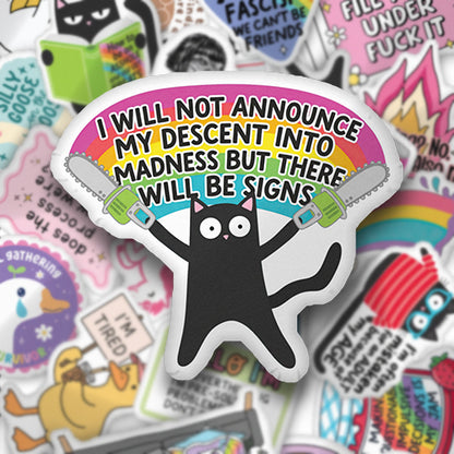 Custom-shaped pillow with black cat graphic and bold quote text in bright colors