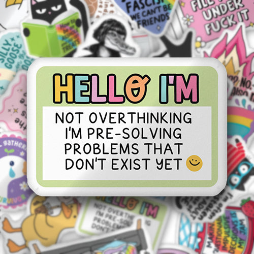 Custom-shaped throw pillow with colorful 'HELLO I'M' text and cartoon lettering