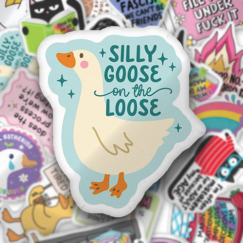 Custom-shaped pillow with blue border and “SILLY GOOSE on the LOOSE” goose print