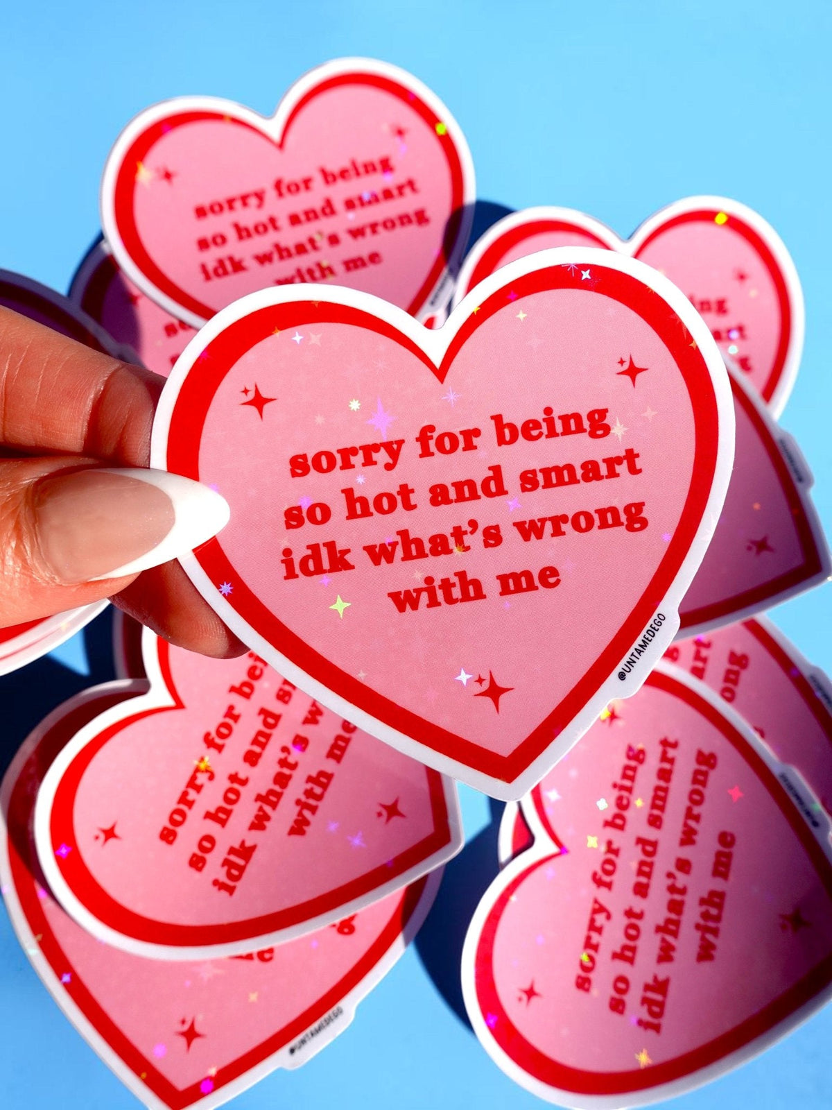 Funny Heart-shaped red/pink stickers with white borders and starry text, stacked