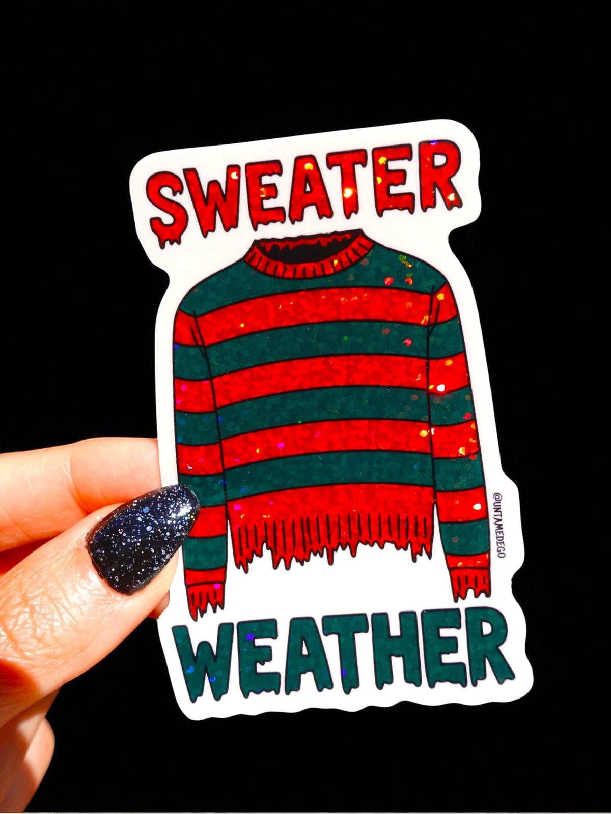 Funny Sweater Weather horror sticker, red and green striped sweater with SWEATER WEATHER words