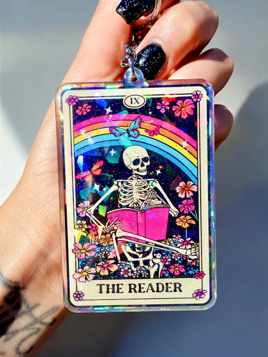 Funny Reader tarot card keychain, colorful skeleton reading book design in a clear frame