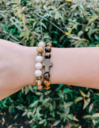 Elevated Faith Christian Jewelry Bracelet with natural stones and cross accent on a wrist