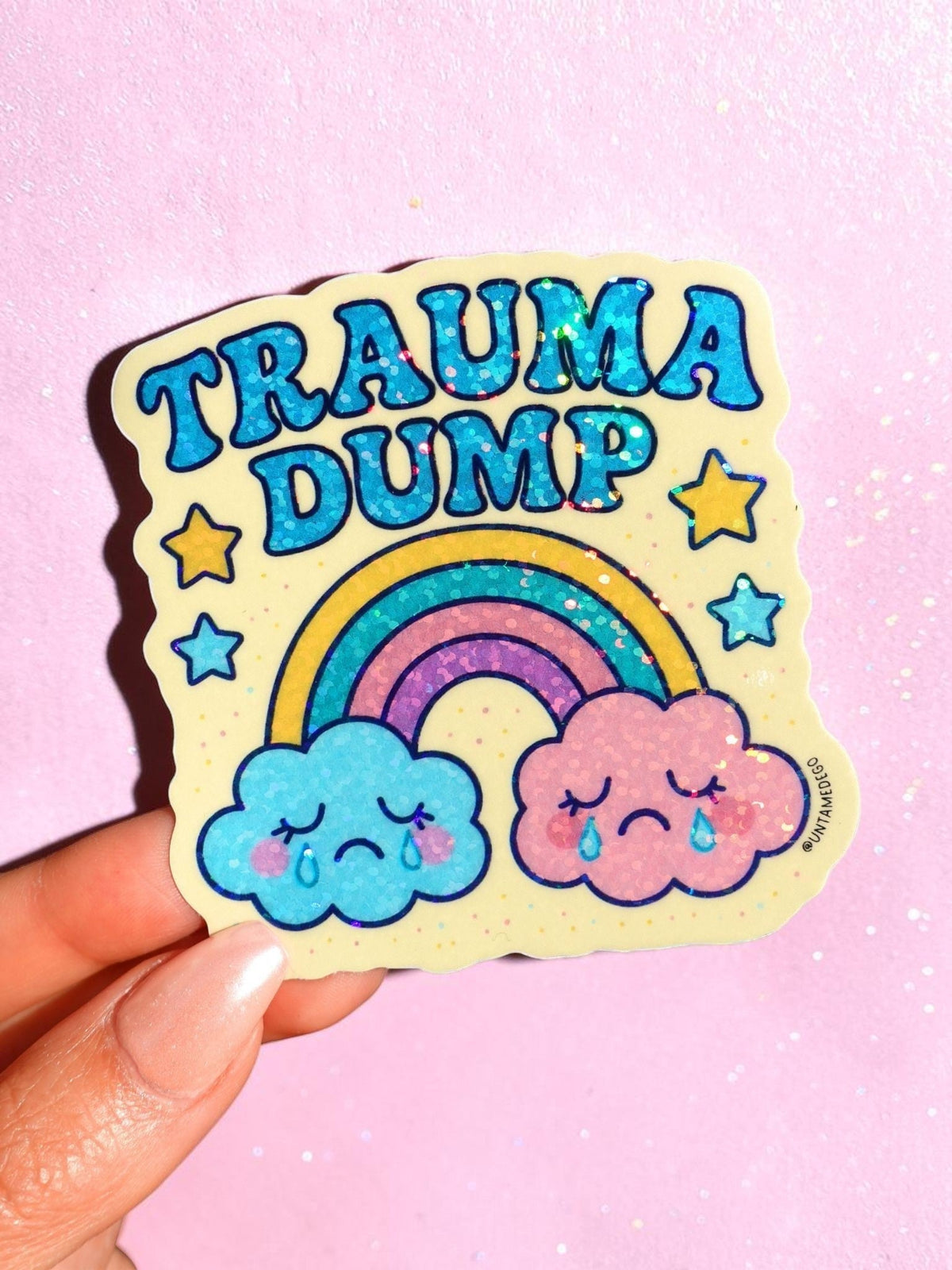 Funny Trauma Dump sticker with rainbow and smiling clouds, star accents, bold blue text