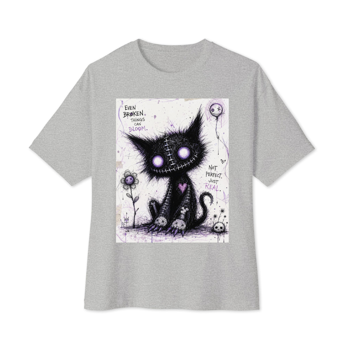 Athletic heather oversized boxy tee with the 'Even Broken Things Can Bloom' goth graphic: a stitched black cat with glowing purple eyes beside a flower, with the words "Even broken things can bloom"