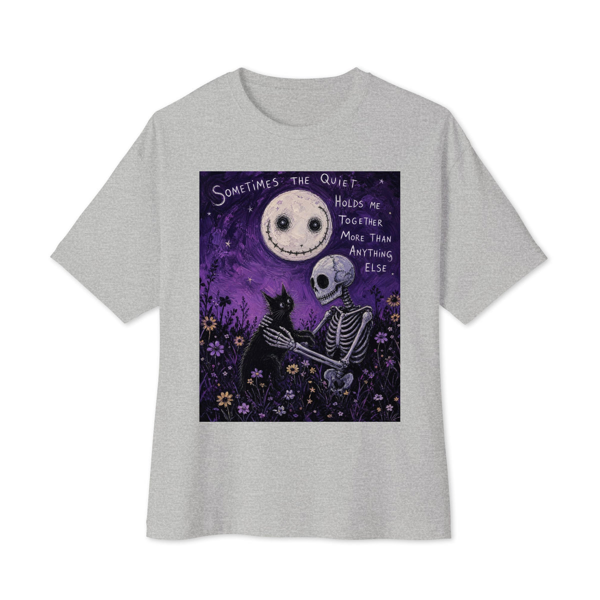 Athletic heather oversized boxy tee with the 'The Quiet Heals' goth graphic: a skeleton and a black cat in a purple flower field under a smiling moon, with the words "Sometimes the quiet holds me together more than anything else"