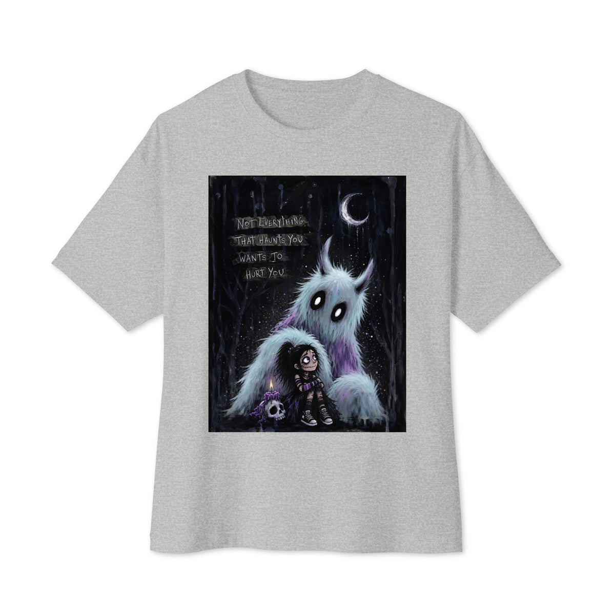 Athletic heather oversized boxy tee with the 'The Haunted' goth graphic: a little goth girl holding a candle beside a fuzzy blue monster under a crescent moon, with the words "Not everything that haunts you wants to hurt you"