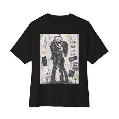 Black oversized boxy tee with the 'I Like The Way You Rot' goth graphic: a pumpkin-headed zombie kissing a purple-haired goth girl, with the words "I like the way you rot"