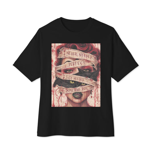 Black oversized boxy tee with the 'Just Something Real' goth graphic: a red-haired woman's face wrapped in bandages, with the words "I never needed perfect, I just needed something real"