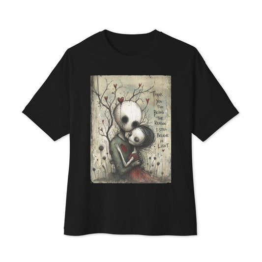 Black oversized boxy tee with the 'My Light In Dark Places' goth graphic: a skull-faced couple embracing under a bare tree with red hearts, with the words "Thank you for being the reason I still believe in light"