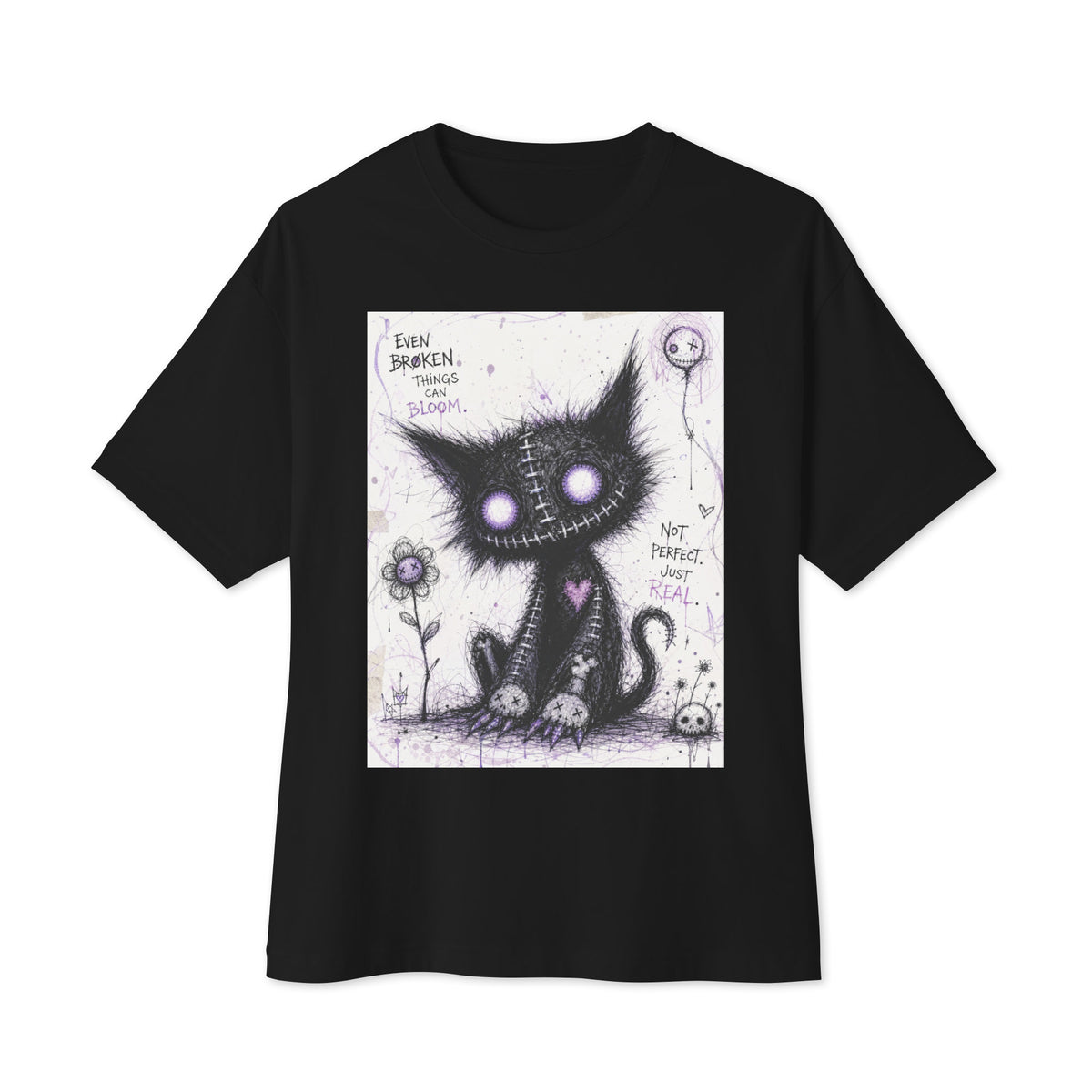 Black oversized boxy tee with the 'Even Broken Things Can Bloom' goth graphic: a stitched black cat with glowing purple eyes beside a flower, with the words "Even broken things can bloom"