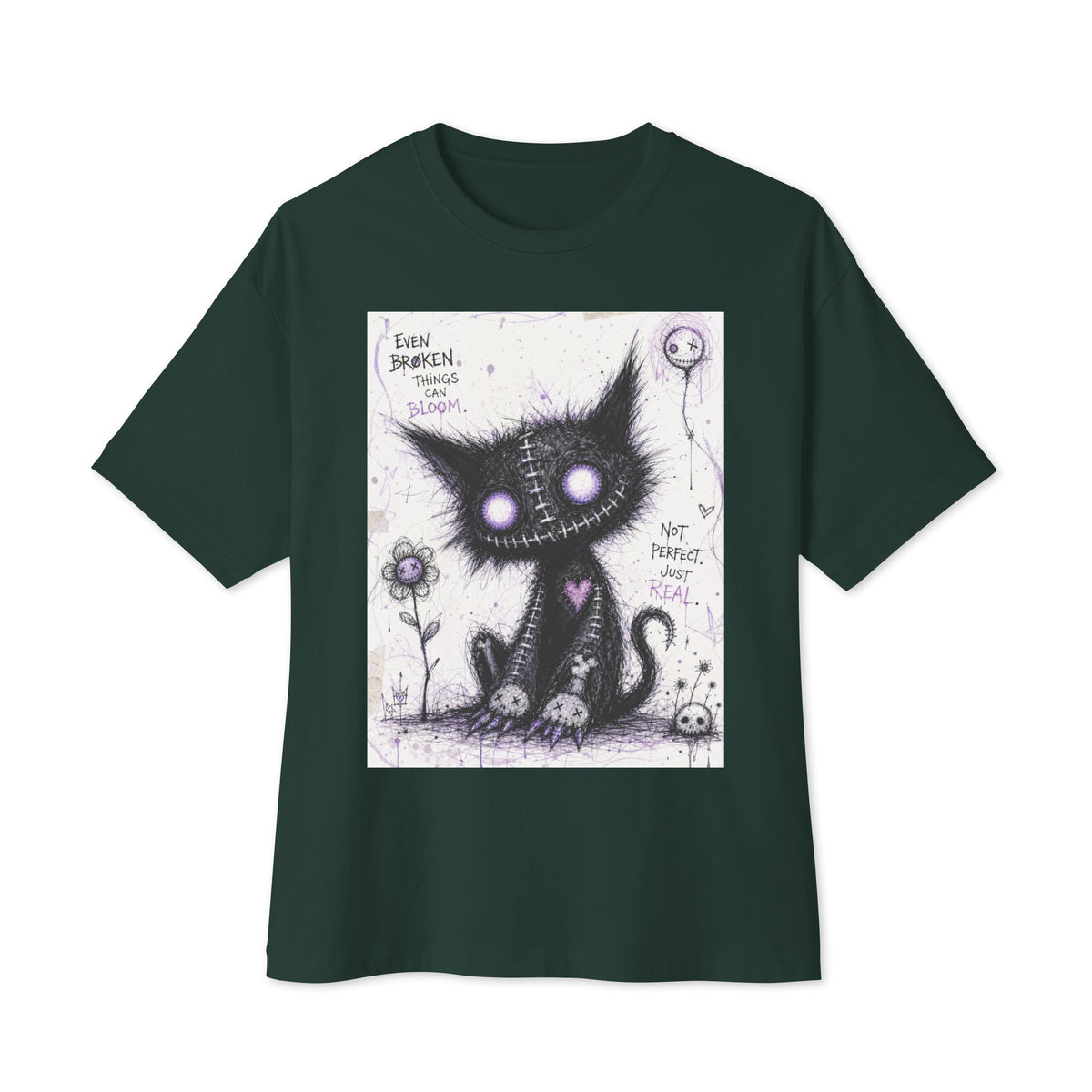 Forest oversized boxy tee with the 'Even Broken Things Can Bloom' goth graphic: a stitched black cat with glowing purple eyes beside a flower, with the words "Even broken things can bloom"
