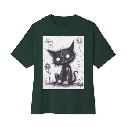 Forest oversized boxy tee with the 'Even Broken Things Can Bloom' goth graphic: a stitched black cat with glowing purple eyes beside a flower, with the words "Even broken things can bloom"