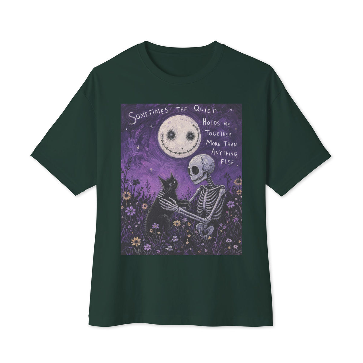 Forest oversized boxy tee with the 'The Quiet Heals' goth graphic: a skeleton and a black cat in a purple flower field under a smiling moon, with the words "Sometimes the quiet holds me together more than anything else"