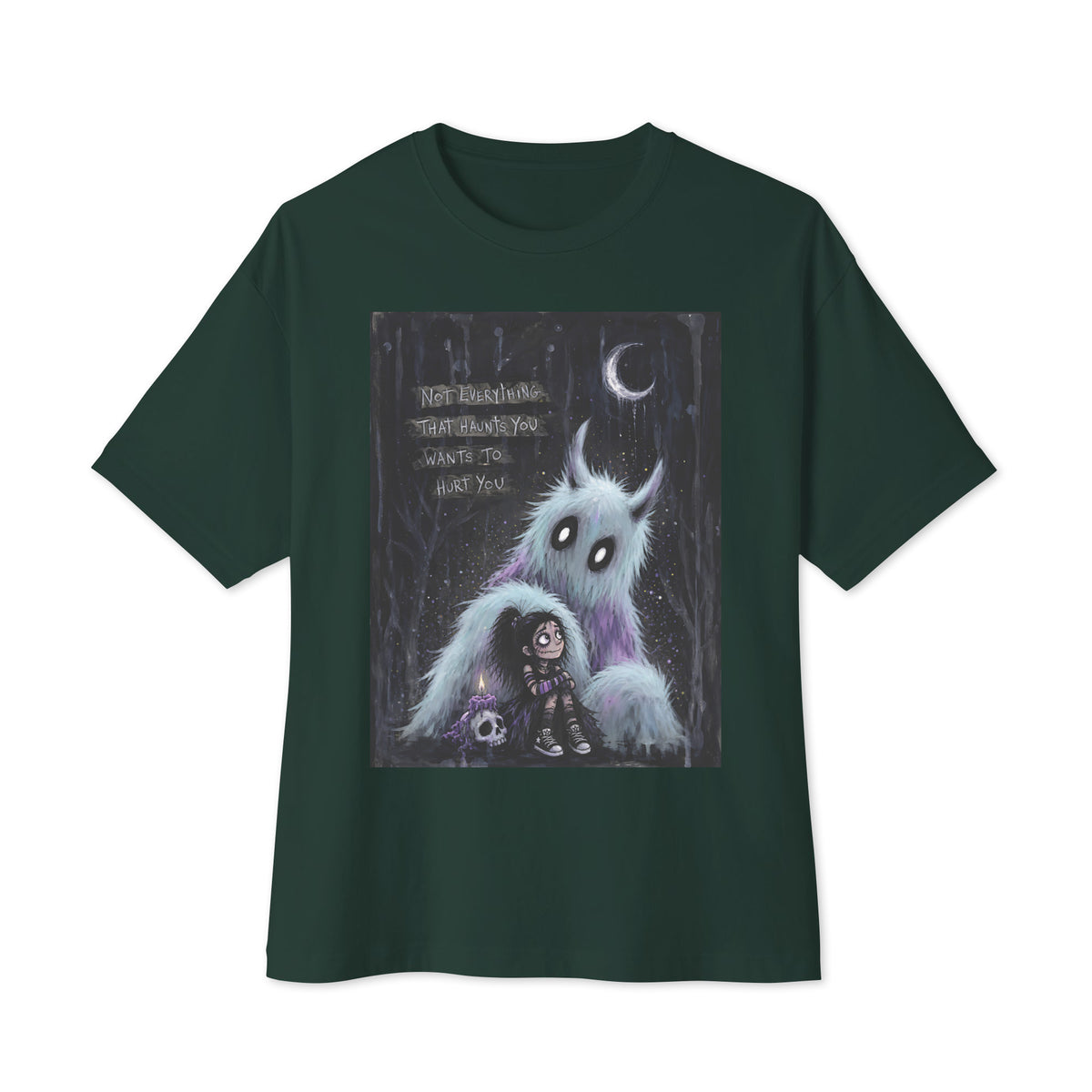 Forest oversized boxy tee with the 'The Haunted' goth graphic: a little goth girl holding a candle beside a fuzzy blue monster under a crescent moon, with the words "Not everything that haunts you wants to hurt you"