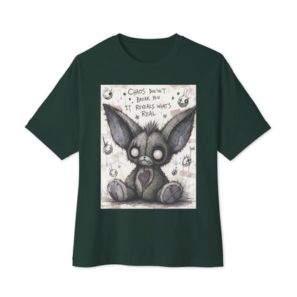 Forest oversized boxy tee with the 'Chaos' goth graphic: a stitched gray big-eared creature with button eyes, with the words "Chaos doesn't break you, it reveals what's real"
