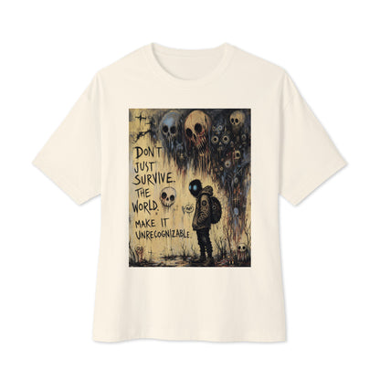 Natural oversized boxy tee with the 'World Changer' goth graphic: a hooded figure beneath looming skulls, with the words "Don't just survive the world, make it unrecognizable"
