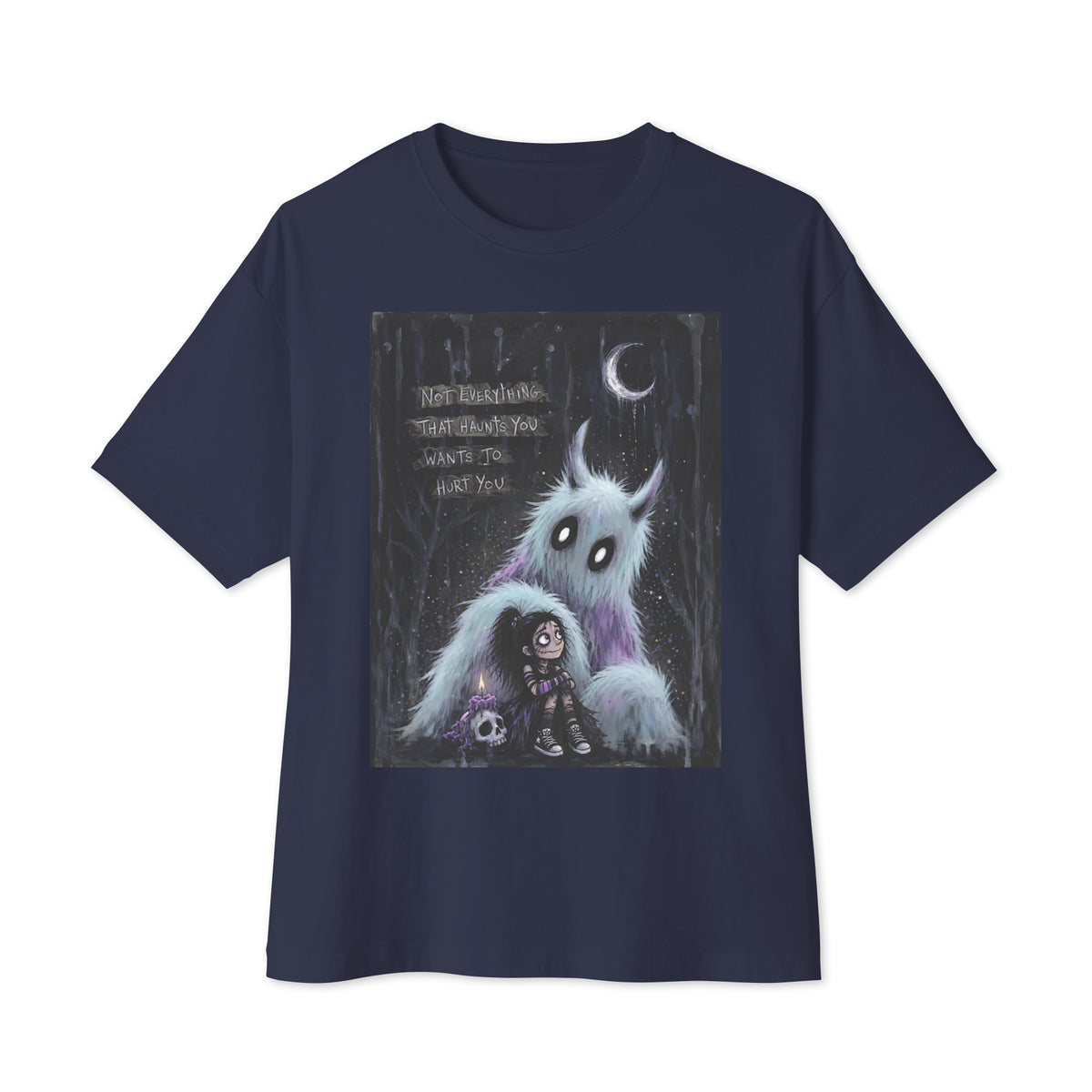 Navy oversized boxy tee with the 'The Haunted' goth graphic: a little goth girl holding a candle beside a fuzzy blue monster under a crescent moon, with the words "Not everything that haunts you wants to hurt you"
