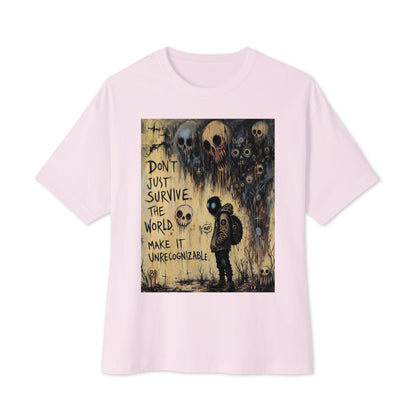 Soft pink oversized boxy tee with the 'World Changer' goth graphic: a hooded figure beneath looming skulls, with the words "Don't just survive the world, make it unrecognizable"