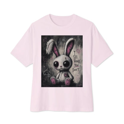 Soft pink oversized boxy tee with the 'I See Things You Don't' goth graphic: a stitched white bunny with hollow eyes, with the words "I see things you don't"