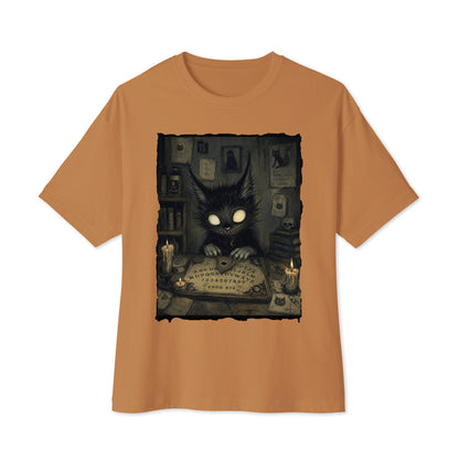 Toast oversized boxy tee with the 'Free Readings' goth graphic: a wide-eyed black cat creature at a Ouija board surrounded by candles