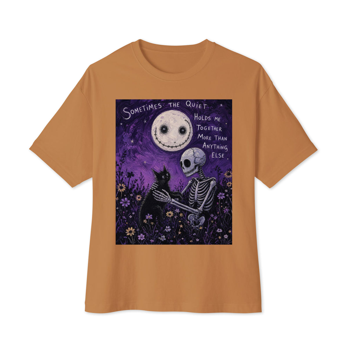 Toast oversized boxy tee with the 'The Quiet Heals' goth graphic: a skeleton and a black cat in a purple flower field under a smiling moon, with the words "Sometimes the quiet holds me together more than anything else"